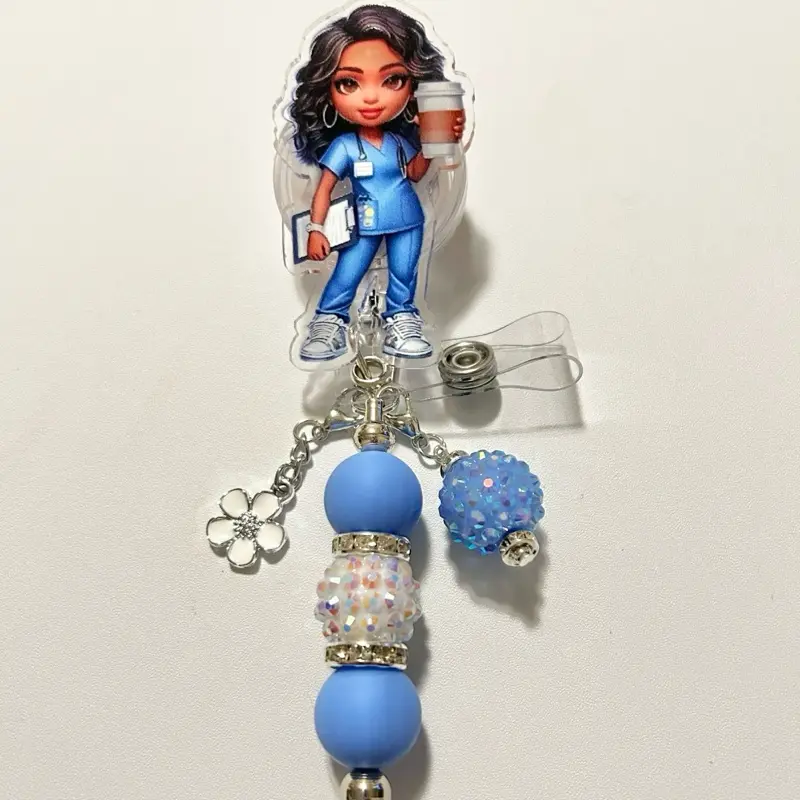 Charmed- Cute trendy retractable badge reel with alligator clip and colorful beads. Charms may vary from photo but will match colors in acrylic piece.