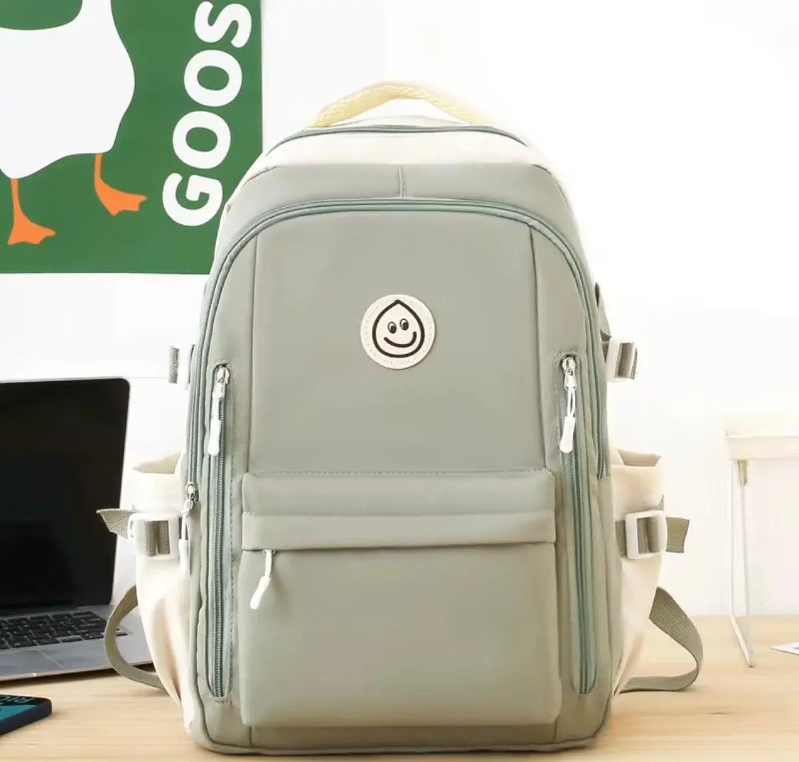 Neutral Green Athletic Small Backpack - Durable, Lightweight, Versatile, Padded Straps, Zipper Closure, Playful Smiley Patch, Multiple Zippered Pockets, Campus Carry-All Backpack, Small Backpacks, Athletic Backpacks