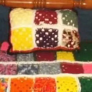 Crocheted Granny Square Blanket with Colorful Patchwork and Includes Same Pillow