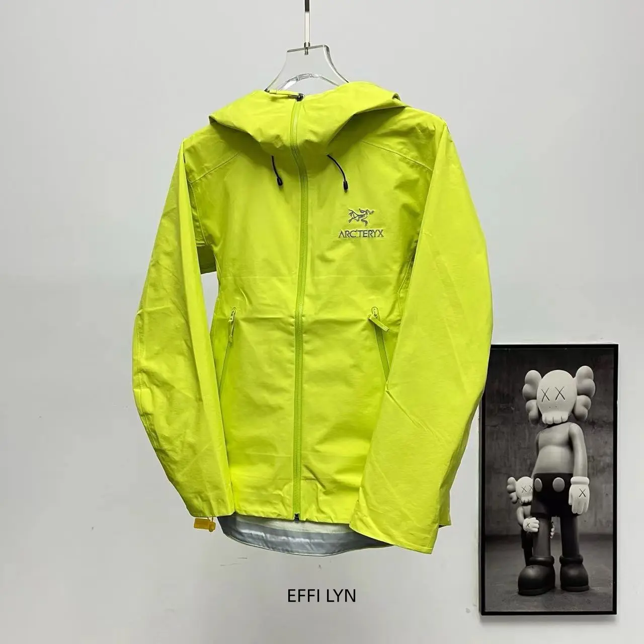 Lime-Green Waterproof Jacket for Outdoor Outfits, Adjustable Hood for Weather Adaptability, Sealed Zippers to Prevent Rainwater Seepage (Sports Collectibles Accessory)