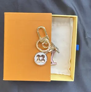 TURN YOUR KEYS INTO A STATEMENT. | Hand-Engraved 24K Gold Plated Keychain — More Than Utility, Its Identity.