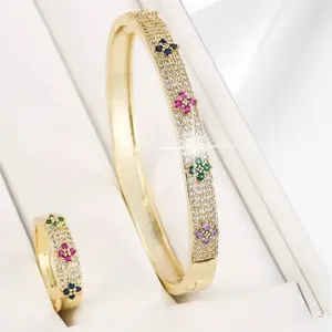 Elegant Gold Bangle and Ring Set with Multicolor Gemstones and Floral Design