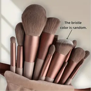 A set of 13 professional makeup brushes, including soft fur eyeshadow brushes, foundation brushes, and blush brushes, for creating a perfect makeup look