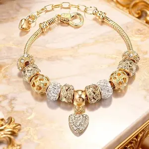 This luxurious bracelet—crafted from gold, silver, and crystal beads—is a dazzling and captivating jewelry masterpiece. It is adorned with an exquisite, delicate heart-shaped pendant and features an adjustable snake-chain clasp.