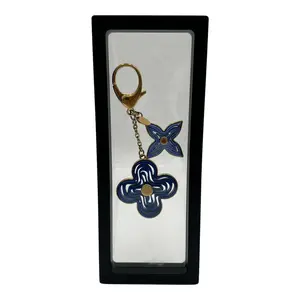 Pre-owned LOUIS VUITTON METAL Bag Accessories Resin Naif Bag Charm Keychain with Blue Floral Design and Gold Accents