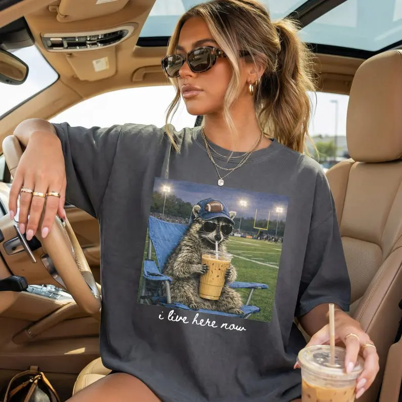 Comfort Colors Raccoon I Live Here Now Football T Shirt, Funny Game Day TShirt, Sports Mom Gift Graphic Tee Womenswear Cotton Top