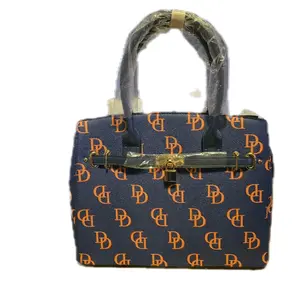 Elegant Navy Blue Handbag with Orange Logo Pattern and Gold Hardware