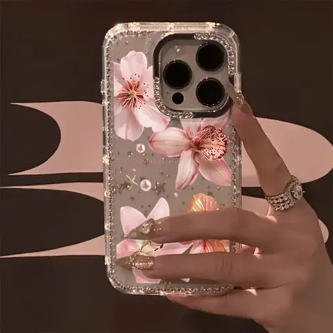 A unique and luxurious rhinestone lily pattern phone case with a transparent, shimmering starlight design.Suitable for iPhone 17 Pro Max/17 Air/iPhone Air/16 Pro Max/15 Plus/14/13/12.Perfect for Christmas and Halloween gifts.