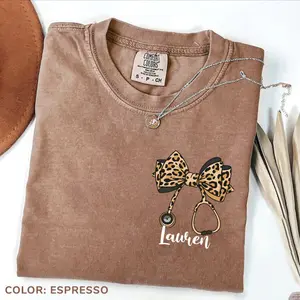 [CUSTOM] Comfort Colors Custom Leopard Nurse T-Shirt, Coquette Stethoscope Bow Graphic Tee, Cute RN Nursing Shirt, Gift for Nurses