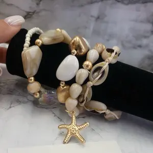 Sea Shell Charm Bracelet with Gold Starfish Accent & Natural Beads for Beach Style Accessory