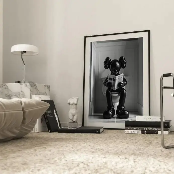 Black Kaws Figure Sitting on the Toilet Reading a Newspaper, Kaws Poster No Frame