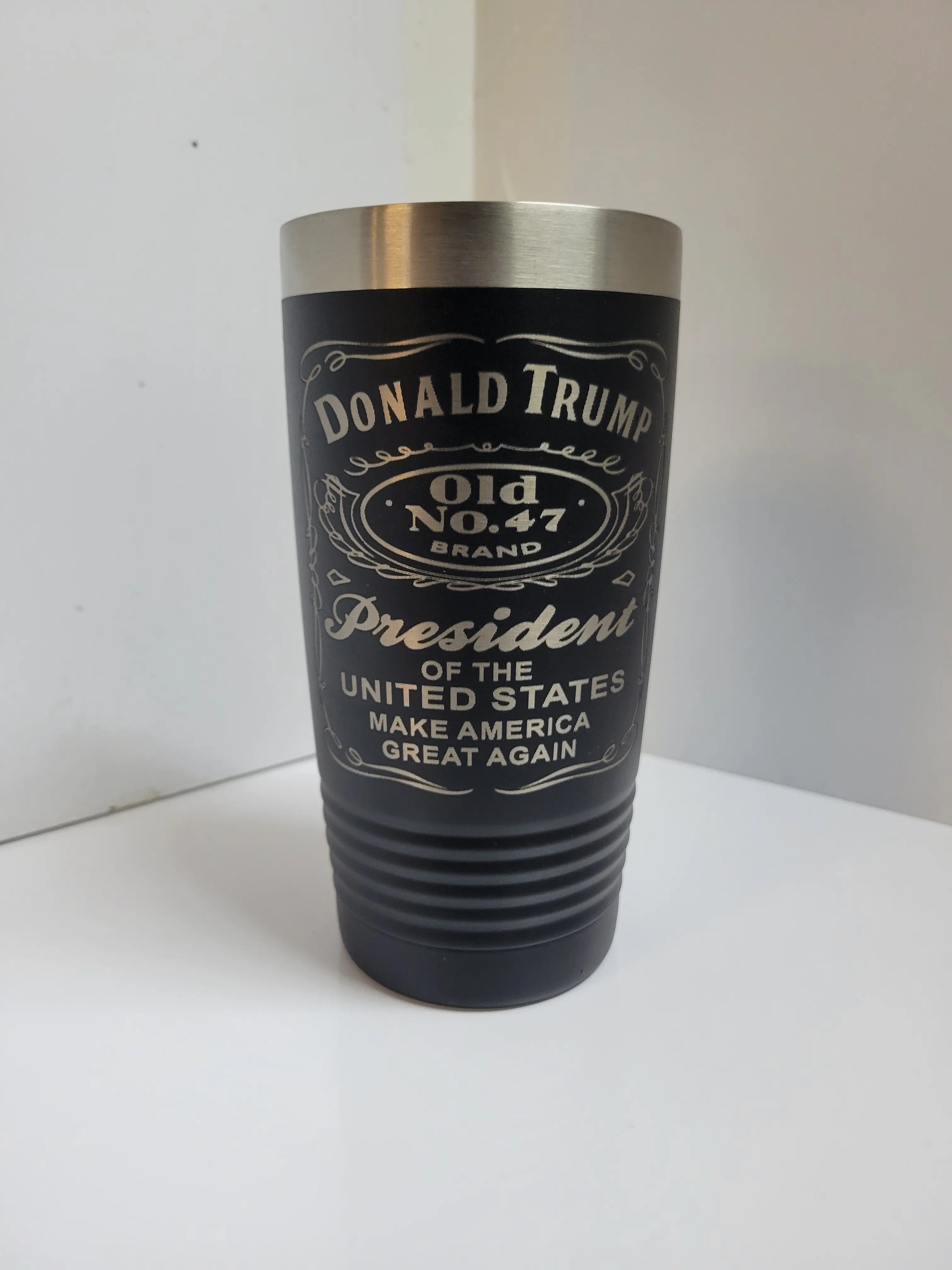 Donald Trump tumbler, insulated with slid lid and sip hole.