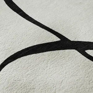 HomeRoots 678689 3 x 5 ft. White & Black Abstract Washable Machine Made Rectangle Area Rug with UV Protection
