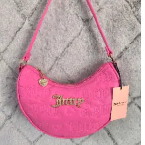 Juicy Couture Pink Embossed Logo Crossbody Bag with Adjustable Strap and Gold Hardware