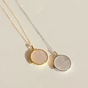 Pearl Disc Locket Necklace by Caitlyn Minimalist.