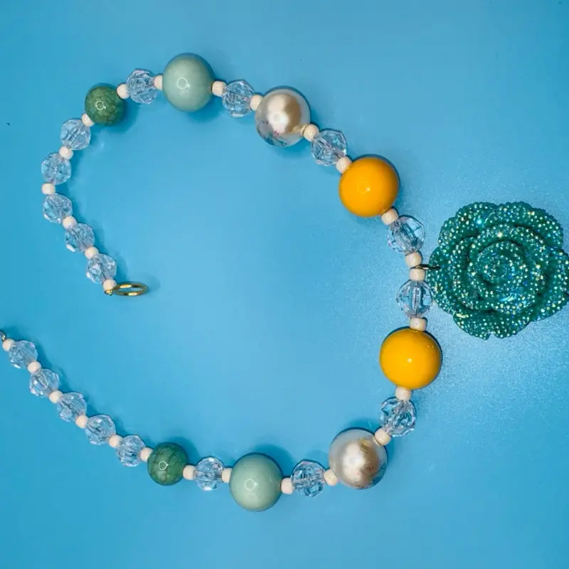 Blue and Yellow Necklace with Sparkling Flower Pendant