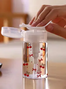 New red cherry and bowknot pattern refillable bottle, made of PET material, a reusable makeup remover dispenser bottle, Makeup remover tool, with a 3.38 oz portable pump, suitable for nail polish remover and makeup remover. Hand wash only