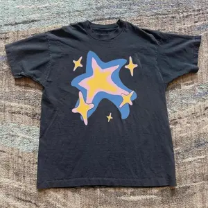 Black Star Graphic Baby Tee With Pink And Blue Accents – Y2K Aesthetic Graphic Top