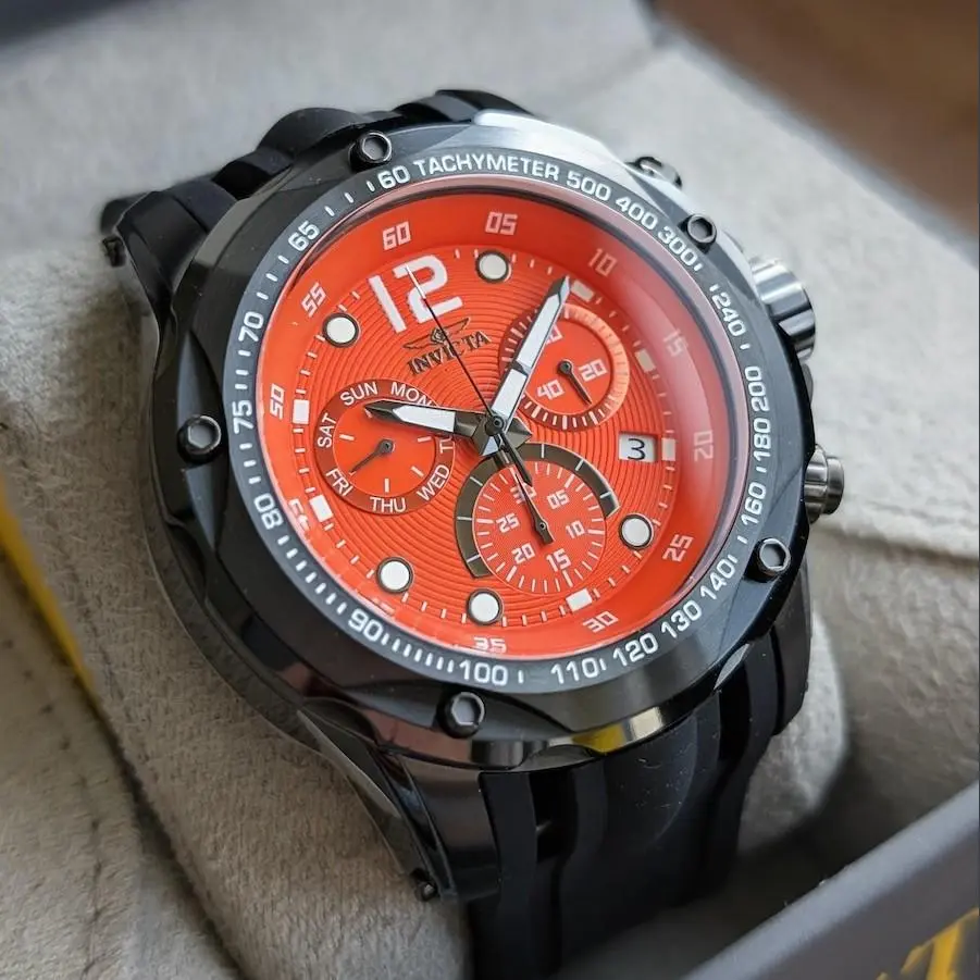 Invicta Speedway Orange Dial Men's 51mm Swiss Chronograph Watch Black Gunmetal Case Tachymeter Bezel Day and Date Triple Subdial Black Silicone Sport Strap Racing Style Oversized Bold Statement 50m Water Resistant Push Crown Buckle