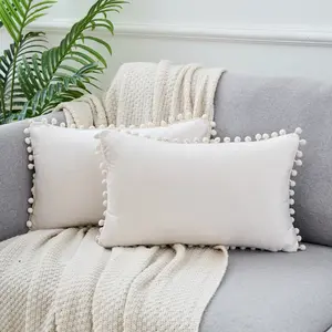 REGALWOVEN Pack of 2 Velvet Throw Pillow Covers with Pompoms  Decorative Pillow Cases Fringe Cushion Covers Velvet Square Sham  for Farmhouse Bedroom Living Room 12 x 20 Inch Beige