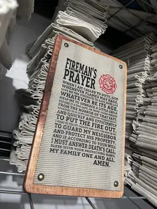 This is a fire hose sign with the fireman's prayer for a firefighter or fireman. This is a 100% made USA product from Crafty American