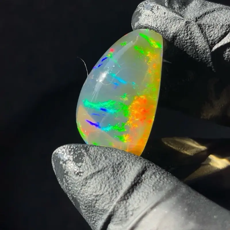 65 carat polished Ethiopian specimen opal with contra luz effect and stunning rainbow flashes!