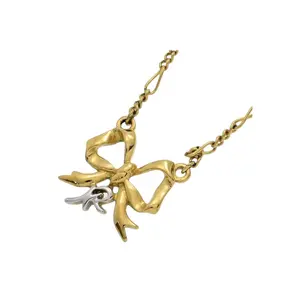 Nina Ricci Gold-Plated Bow Pendant Necklace with Crystals with unique chain