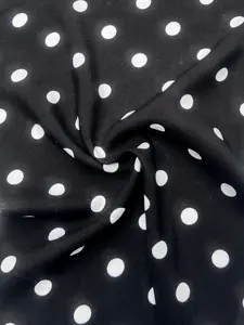 White polka dots on black rayon challis