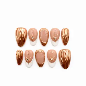 Press on nails  Golden Hour Muse Press On Nails, Medium Almond, Nude Peach Base, White French Tips, Gold Chrome Accents, Starburst Details, Glossy Finish Prette Nail Studio
