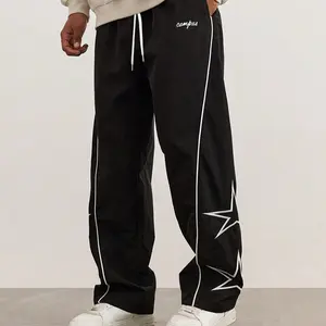Men's black and white colorblock star print sweatpants, featuring a loose straight fit for casual comfort. The drawstring waistband offers a customizable fit, while the cool design effortlessly captures American street style. A must-have for everyday outi