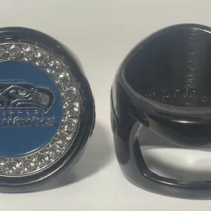 The SEATTLE deCAPitator ring bottle cap & can tab opener, busts open your favorite beverage with a flick of the wrist.