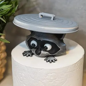 A cute 3D printed raccoon tissue holder-The bathroom is decorated with expressive eyes and durable plastic, providing space-saving novel gifts for animal lovers and eccentric home accessories.