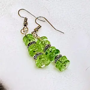 handmade earrings with bright green stacked beads and silver tone accents