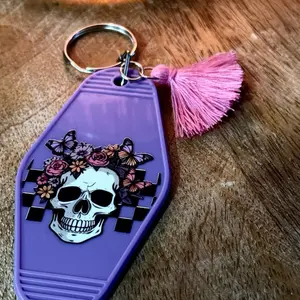 Skull and Butterflies Motel Style Keychain with Pink Tassel Purple Design