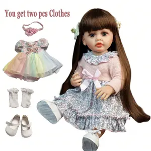 KEIUMI Betty Reborn Doll - 22in (55cm) Lifelike Newborn Full Silicone Baby Girl, Long Brown Hair, Blue Eyes, Pink Bow Floral Dress, White Canvas Shoes, Bonus: Rose Dress, Pearl Headband, Lace Socks, Milk Bottle, Gift for Kids 3+ (Birthday, Christmas)