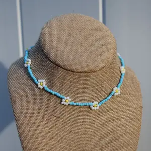 Gigi Boucheron's Blue Daisy Beaded Choker from 'The Summer I Turned Pretty' | TSITP jewelry | Gigi's seed bead necklace | Teen Jewelry