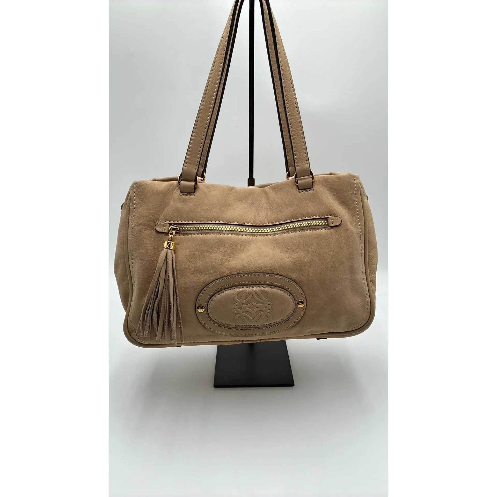 Pre-owned Leather Luxury Bags & Accessories Loewe Vintage Anagram Tassel Shoulder Bag, Beige Date Code: 340802H. Entrupy ID: 7R24K8J.