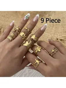 9 Piece Vintage Inspired Ocean Themed Titanium Steel Ring Set Featuring Nautical Fans Seashells Bow Knots Hollow Starfish Designs for Women Girls Fashion Jewelry