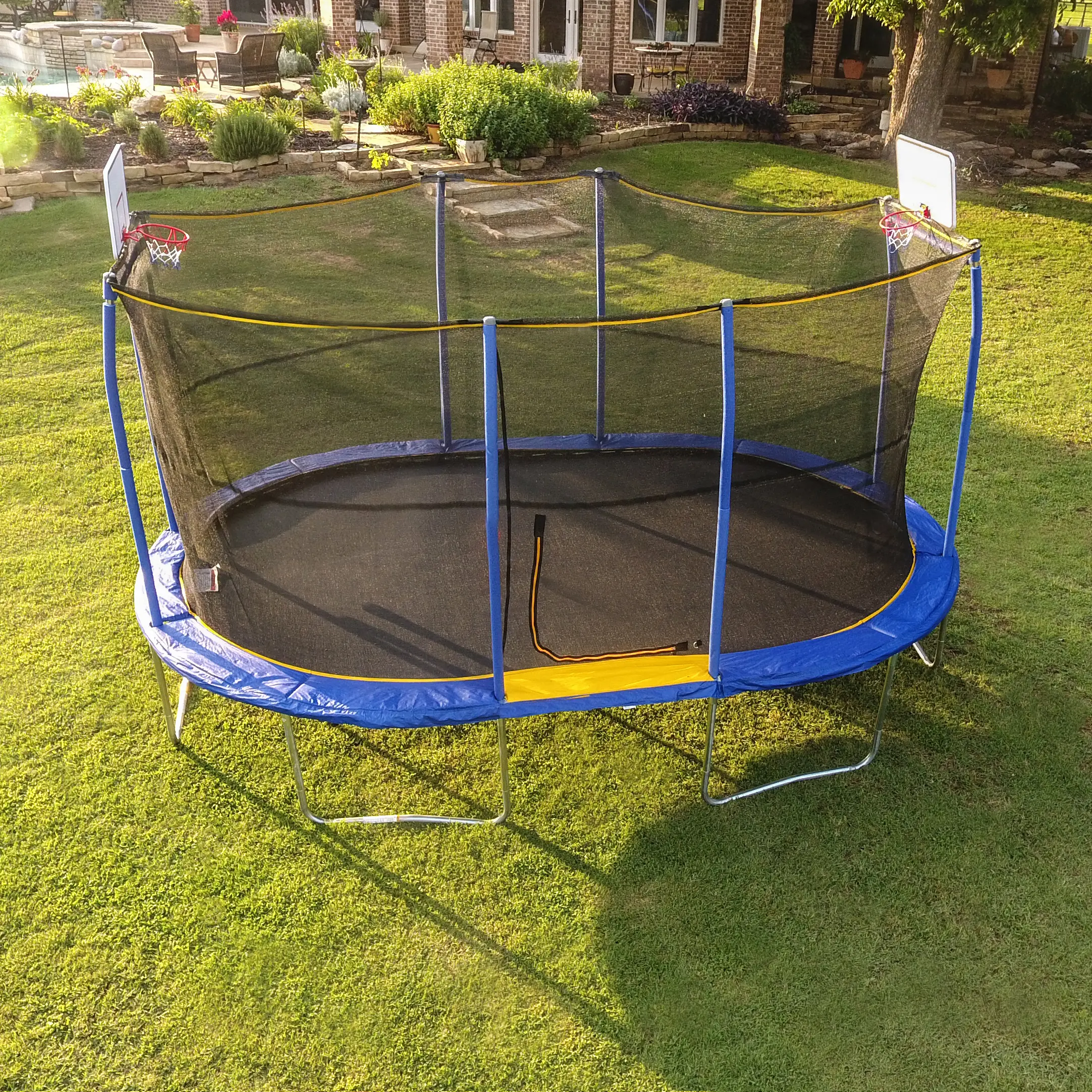 Jumpking 10ft x 15ft Oval Trampoline with Dual Basketball Hoops – The Ultimate Backyard Adventure for Family Fun and Fitness!