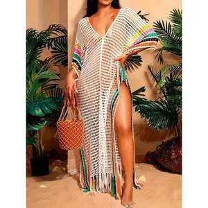Plus-size women’s striped print sweater dress with fringe trim and a hollow slit at the thigh, featuring batwing sleeves and a V-neck cover; long knitted beach cover-up