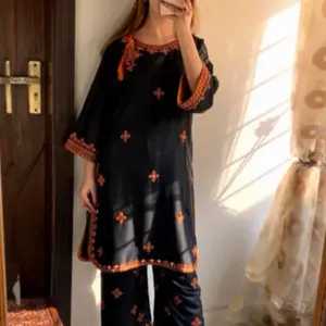 Pakistani Elegant Black & Orange Embroidered Kurta Set with Flared Sleeves and Matching Pants for Women