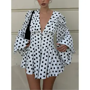 Women’s polka dot babydoll mini dress with long sleeves, V-neckline, ruched waist, and A-line silhouette; elegant French-inspired vacation outfit—perfect for summer dates and brunch.