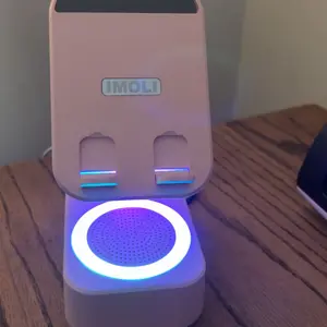 IMOLI Wireless Bluetooth Speaker with Phone Holder, with Smart Sensing Function, HD Surround Sound, Adjustable and Foldable, 6 Hours Playtime, Compatible with iPhone/iPad/Samsung etc.