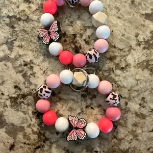Neon, pink butterfly silicone wristlet
