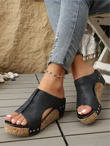 A pair of summer wedge-heeled thick-soled studded sandals for women, thick-soled platform slip-ons, high-heeled slippers for outdoor wear