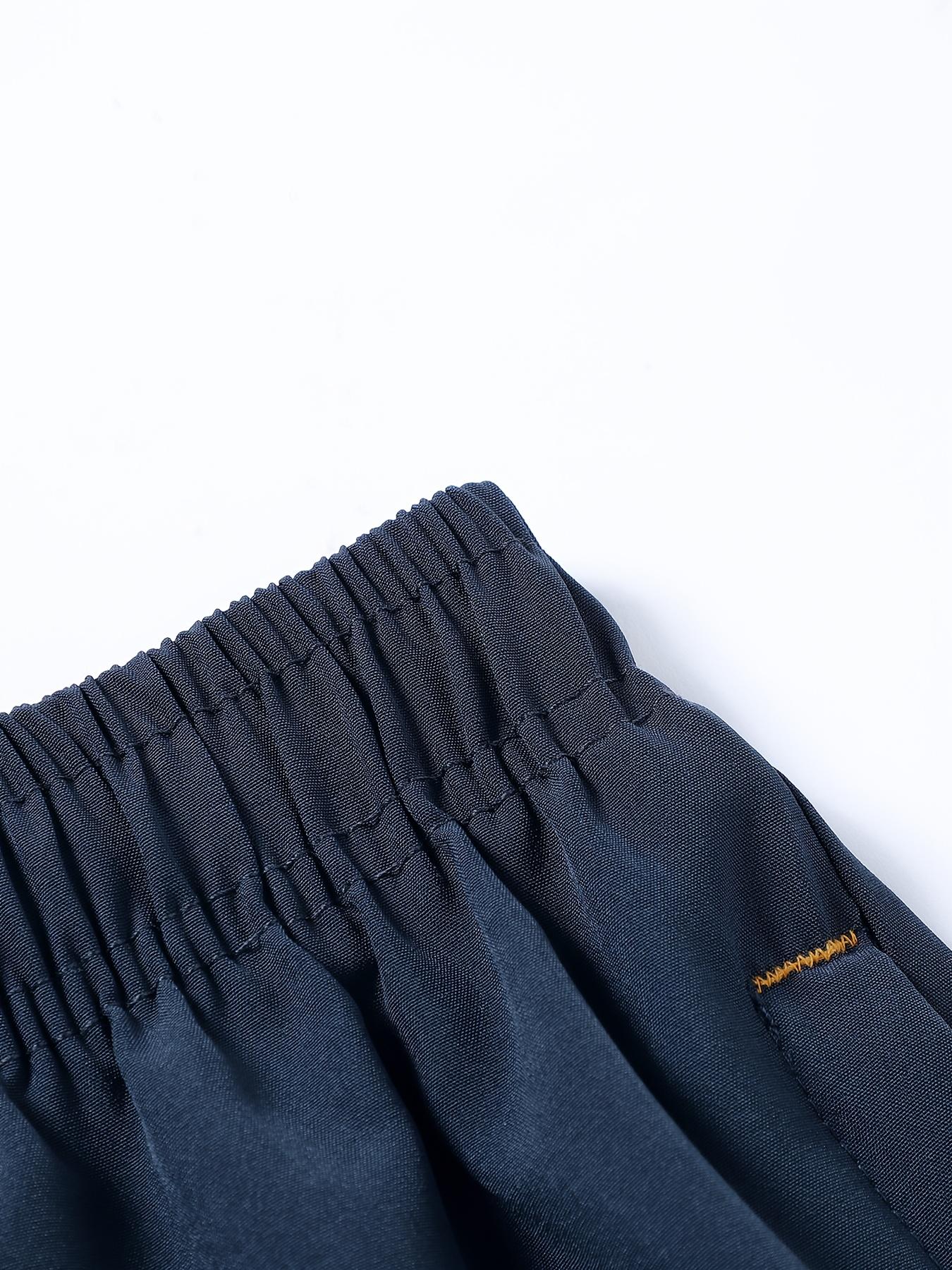 Lightweight Summer Sports Shorts — Breathable, sweat-wicking, quick-drying; solid color with zippered pockets; suitable for sports and casual wear; breathable textured design tropical beige simple