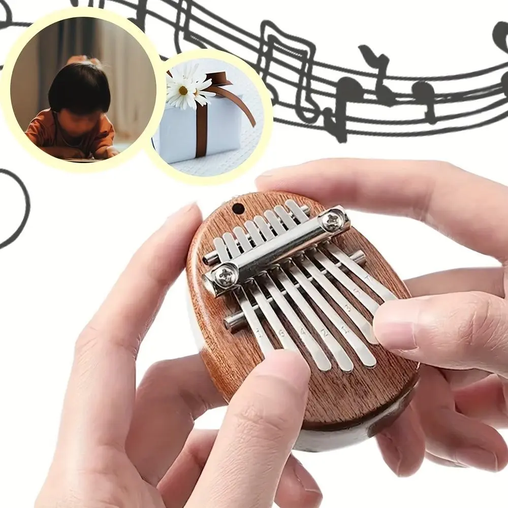 A mini thumb piano Kalimba Instrument that can be carried around, a must-have for music enthusiasts. Exquisite finger piano with hanging rope is an ideal choice for office leisure and decompression, Portable