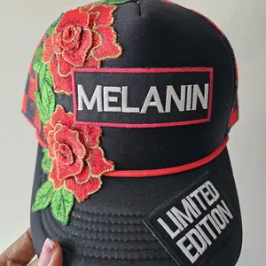 Melanin Limited Edition Trucker Hat with Floral Statement Cap Featuring Embroidered Roses and Bold Logo
