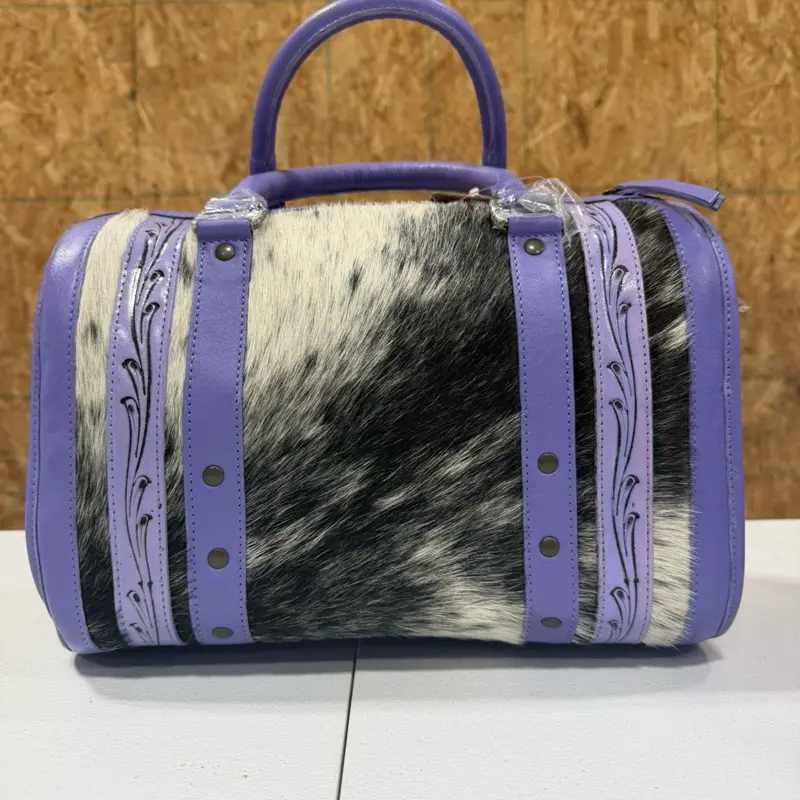 Genuine hand tooled leather & cowhide medium duffel bag- light purple leather with black & white cowhide