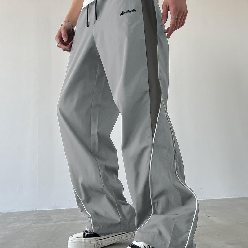 Men's Black Colorblock Sweatpants with White Side Stripes & Embroidered Design for Gym Wear, Loose Athletic Long Pants, Sporty Elegance, Drawstring Waist, Straight Leg Cut, Trendy Street Fashion Joggers Sports Menswear Embroidery Embroidery Tracksuit